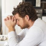 adult-emotional-male-praying-home