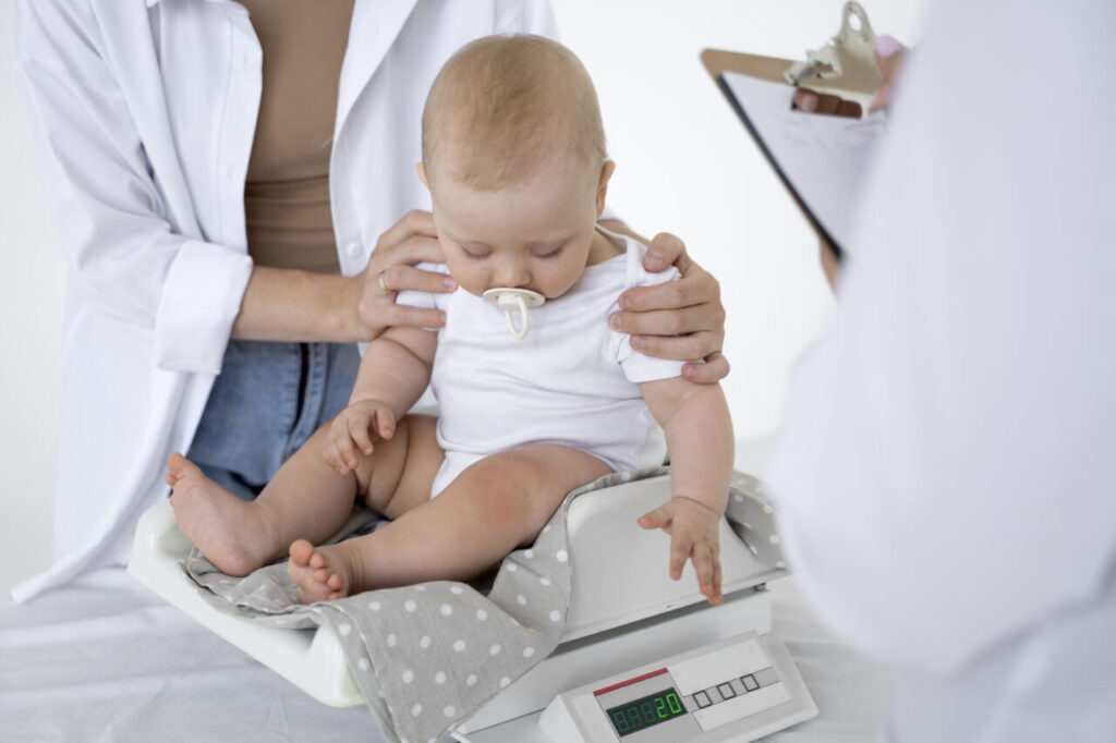 adult-taking-care-baby-weight-1